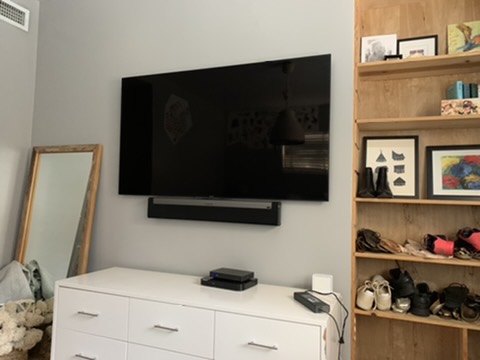 After — bedroom TV + soundbar clean mount