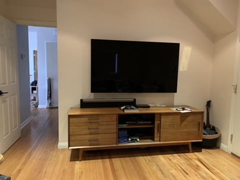 Before — large TV on console